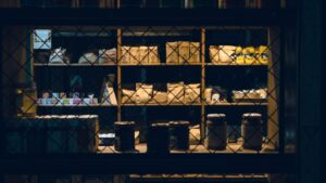 Warmly lit shop shelves showcasing a range of products, captured at nighttime in Rosario, Argentina.