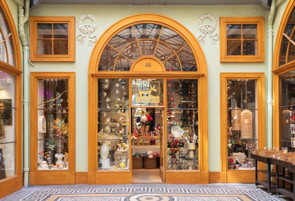 Elegant storefront of a boutique in the historic Galerie Vivienne, Paris.